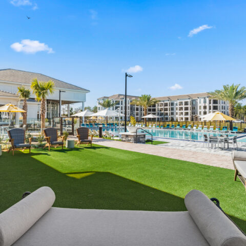 seating on the grass by the pool at Sanctuary at Daytona