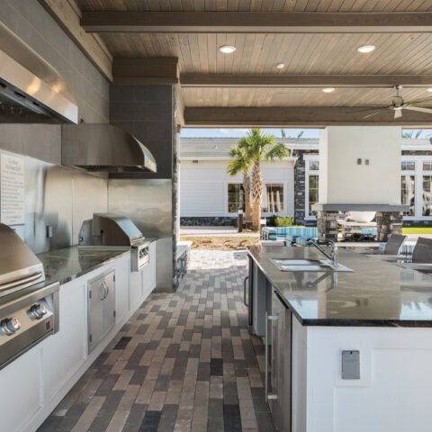 outdoor kitchen will grills and sick on island at Sanctuary at Daytona