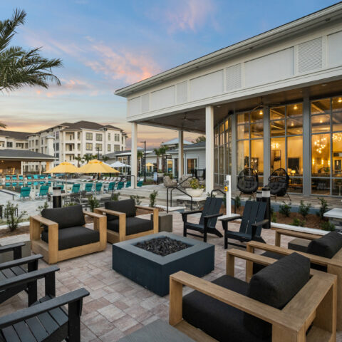Outdoor lounge and fire pit near the pool and clubhouse at Sanctuary at Daytona